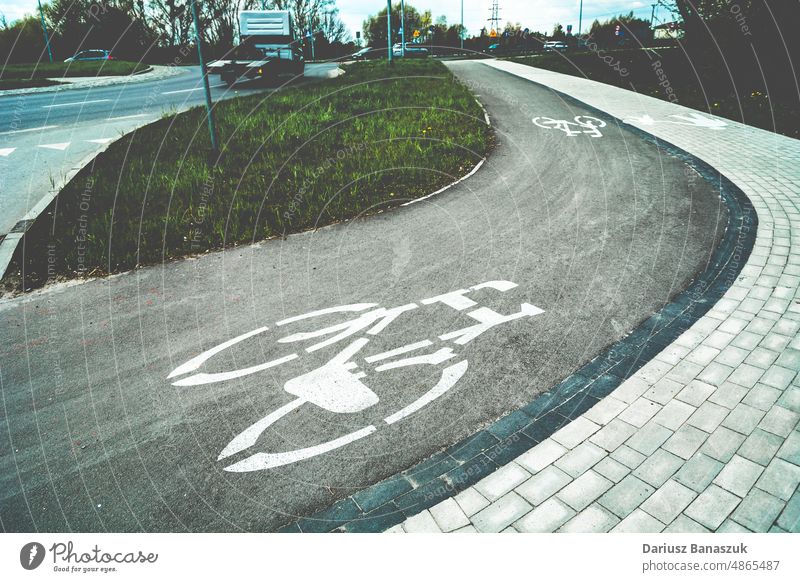 Bend on the cycle path with horizontal signs bicycle road curve bend turn symbol outdoors photography day bicycle lane transportation no people communication