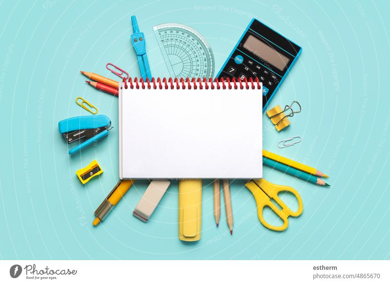 Top view of spiral notepad and school supplies with space for text. Back to school concept education stationery back to school concept students notebooks