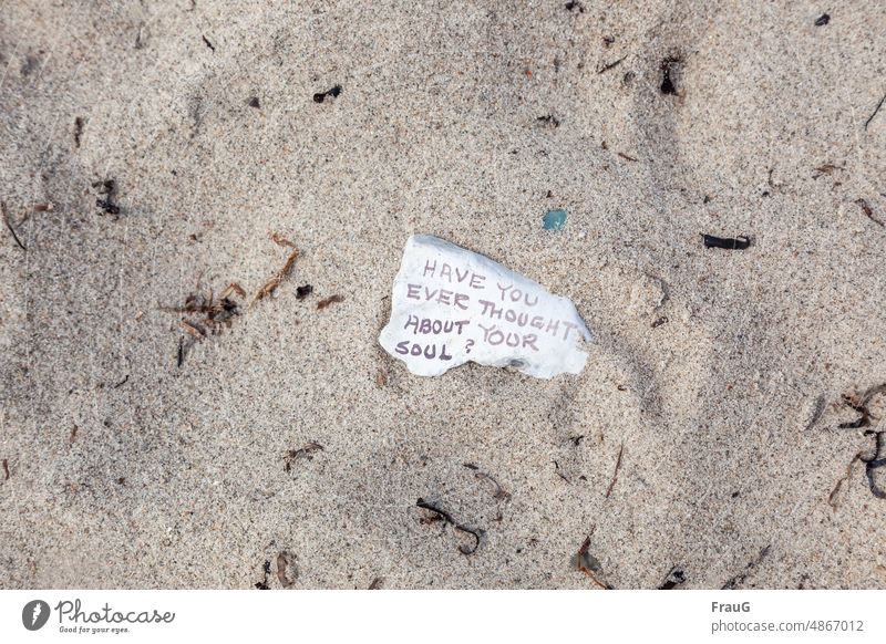 Message in the sand: Have you ever thought about your soul? Beach Flotsam and jetsam Sand Stone Labeled writing embassy food for thought question Ocean coast
