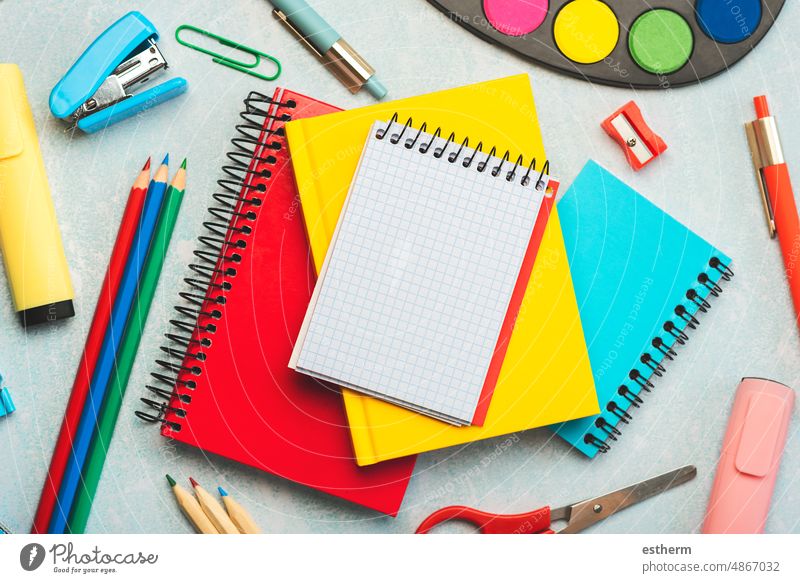 Top view of notebooks,school supplies and spiral notepad with space for text. Back to school concept education stationery back to school concept students