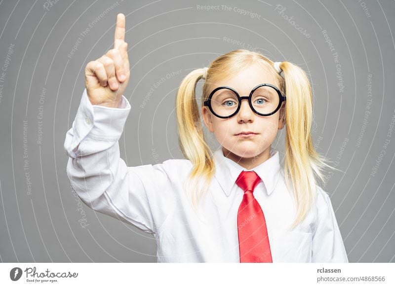 blond girl child with nerdy glasses notify  return for a answer at preschool Brainstorming and idea concept image children communication woman schooling bow tie
