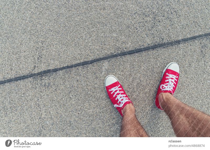 Feet From Above Concept, Teenage Person in Red Sneakers Standing on the street, Blank Copy Space in Front, Point of view shot man pov people lifestyle point