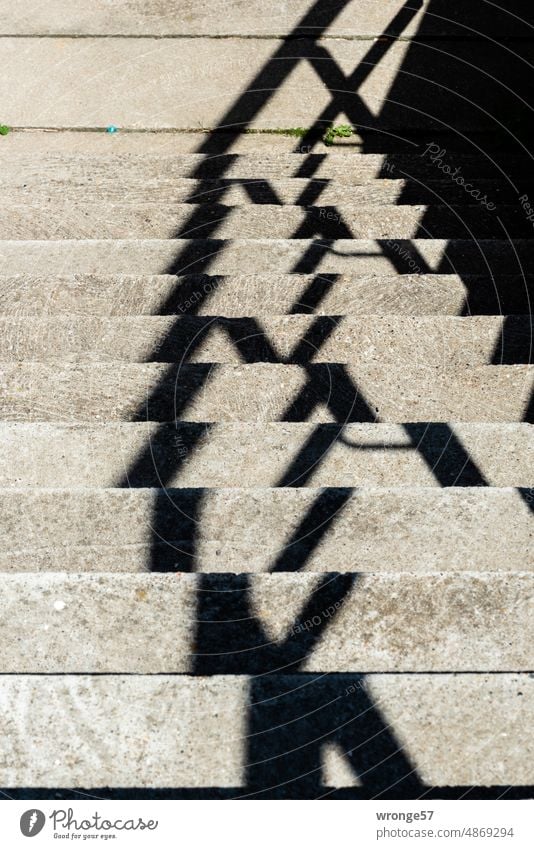Abstraction staircase abstraction downstairs Shadow Shadow play shadow cast handrail concrete staircase Concrete steps sunny Light and shadow