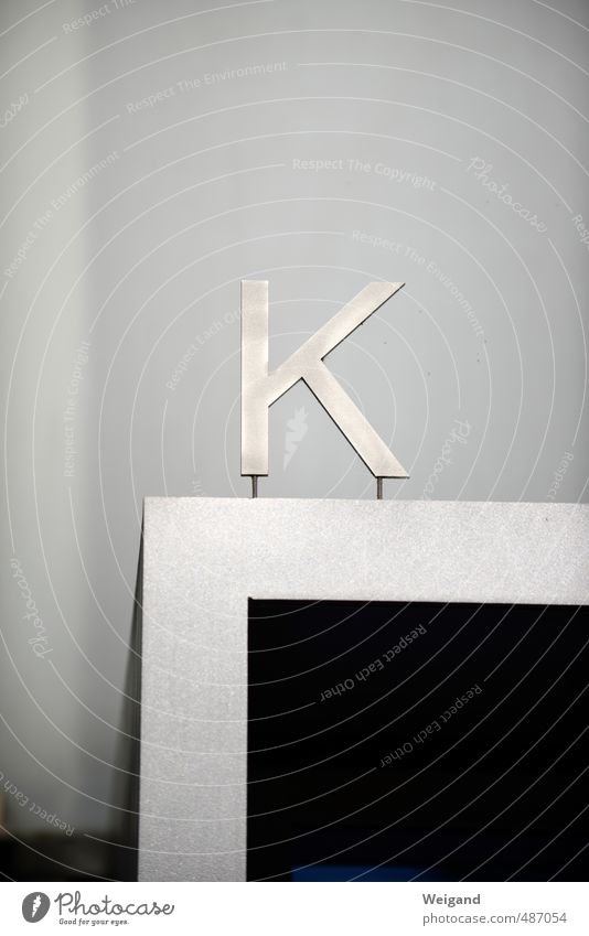 K question House (Residential Structure) Facade Sign Characters Signs and labeling Signage Warning sign Hang Gray Black Silver Far-off places Letters (alphabet)
