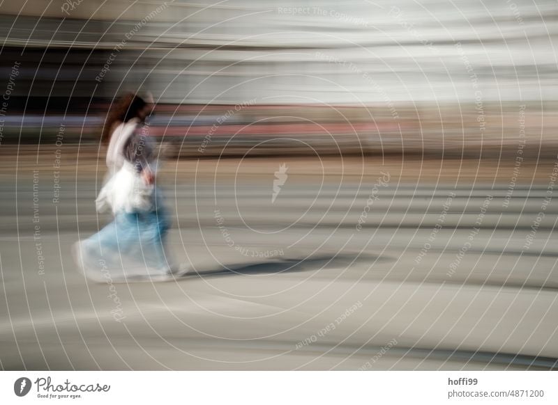 blurred out of focus person rushes across a street through the city Human being Walking hurry Movement Unsharp blurred ICM ICM technology vibrating Abstract