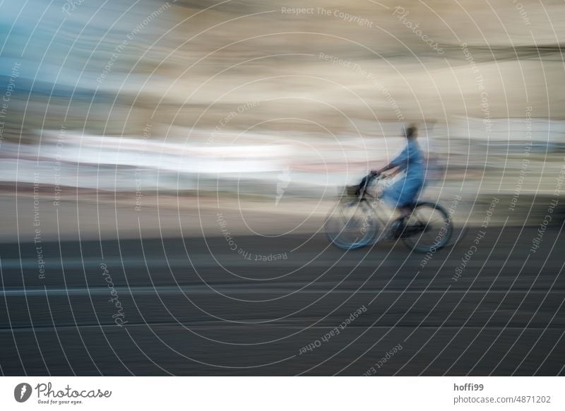 blurred out of focus man riding a bicycle through the city Human being Driving Movement Unsharp blurred ICM ICM technology vibrating Abstract