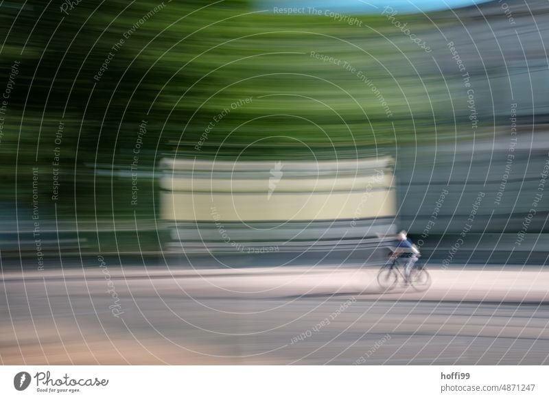blurred out of focus man riding a bicycle through the city Human being Driving Movement Unsharp blurred ICM ICM technology vibrating Abstract