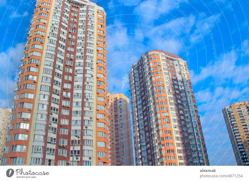 high modern skyscraper and blue sky. View of residential multi-storey buildings multistory house construction floor urban window glass roof design architecture
