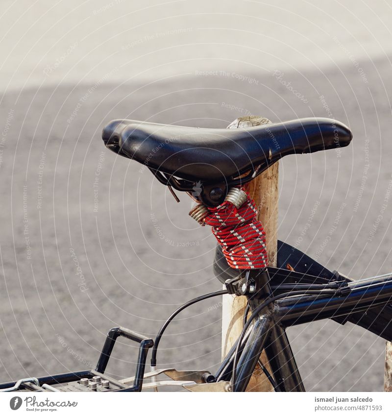 bicycle seat, bicycle mode of transportation in the city bike black cycling biking object hobby street outdoors old wallpaper