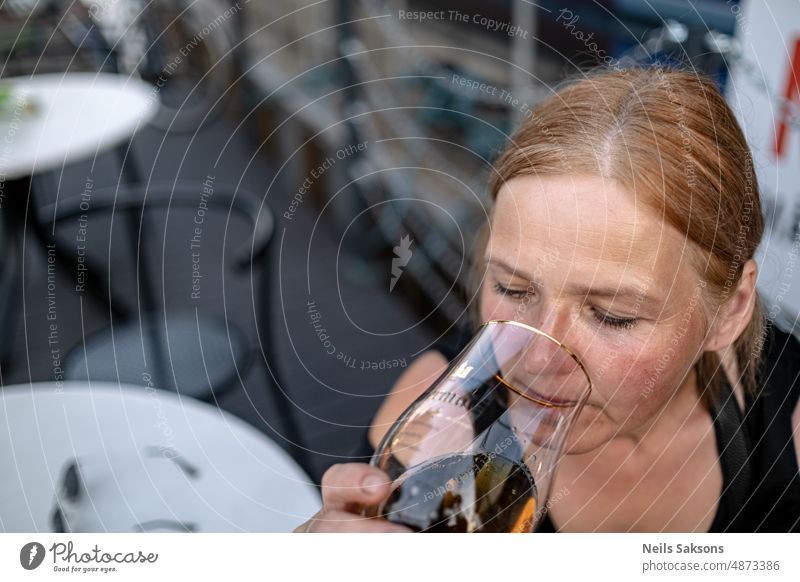 drinking beer in outdoor cafe woman Beer Beer glass Cold drink Beer garden Drinking Colour photo Delicious Alcoholic drinks Beverage Glass Deserted Thirst