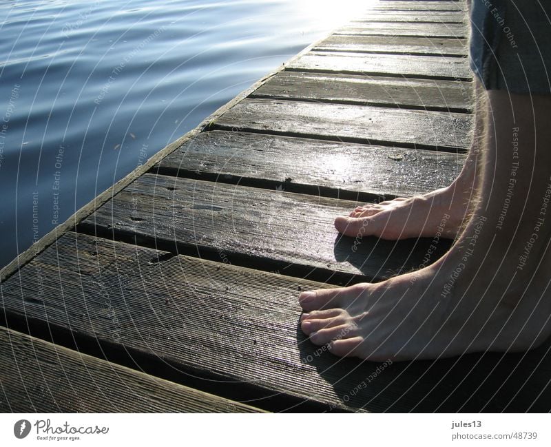 In the morning Ocean Lake Man Individual Footbridge Fresh Wood Moody Stand Calm Loneliness Exterior shot Light Vantage point Detail Perspective Feet atmospehre