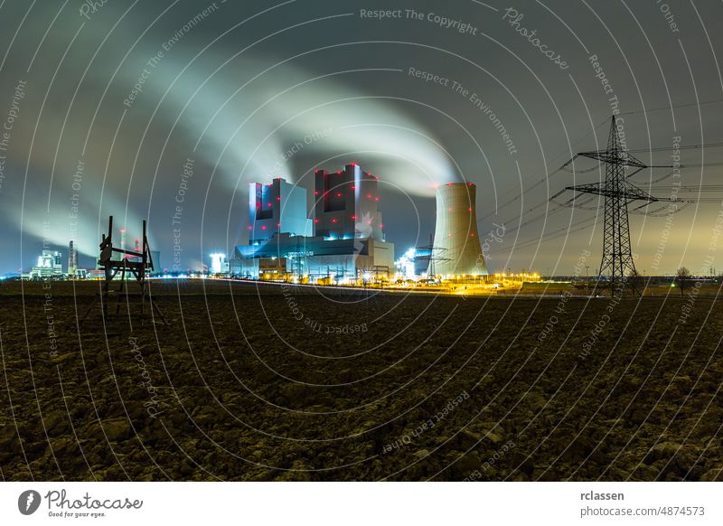 industrial coal power station at night Coal-fired power plant electricity stream cooling tower electricity factory energy steam co2 Lignite Power Plant chimney