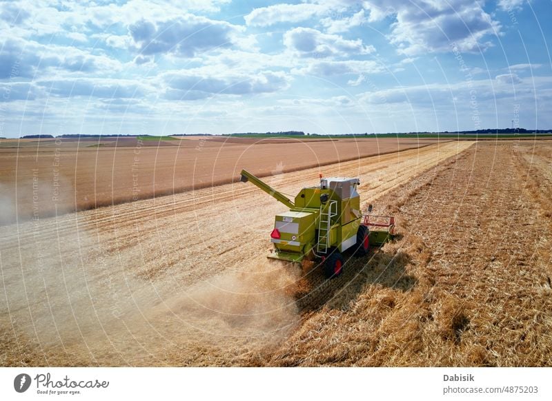 Harvester combine working in the field harvest agriculture wheat farm farmland countryside tractor grain cereal crop industry equipment food machinery rural