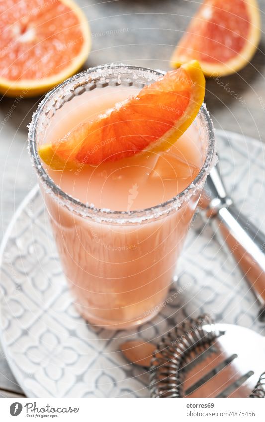 Classic paloma cocktail on white wooden table grapefruit tequila drink alcohol juicy glass isolated food citrus summer lime orange mixed sugar liquid slice