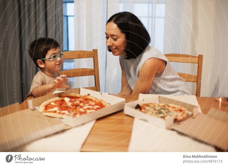 Mom and son eating pizza at home. Pizza delivery. Real people having dinner, smiling and eating pizza comfort food. cuisine service background courier vector