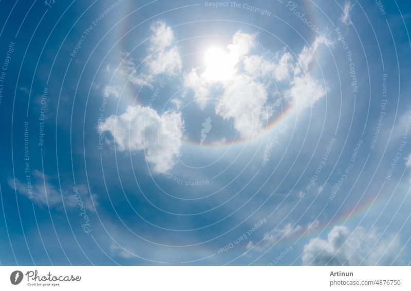Sun Halo or a rainbow-colored ring around the sun. Sunny sky with sun halo. Optical phenomenon produced by light. Cirrus or cirrostratus clouds in the troposphere with light refraction and reflection.