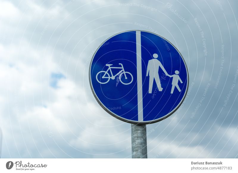 Blue sign for pedestrian and bicycle traffic only blue symbol bike lane path road safety walk route white footpath icon street way person transport cycling