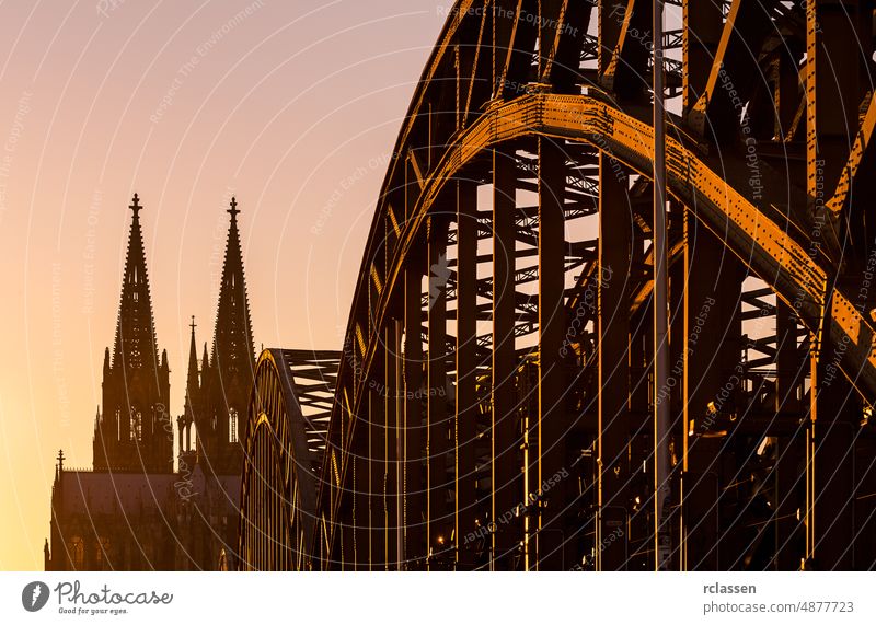 Hohenzollern Bridge and cathedral tops at sunset Cologne city Cologne Cathedral rhine Germany church bridge dusk gothik tourism landmarks silhouette summer