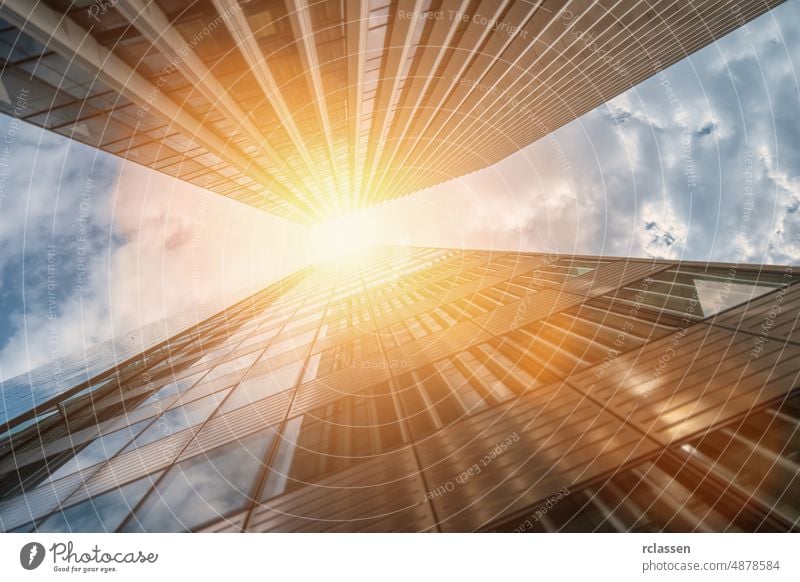 Modern skyscrapers in a business district building angle glass low office architecture perspective commercial sunlight blue city concept corporate development