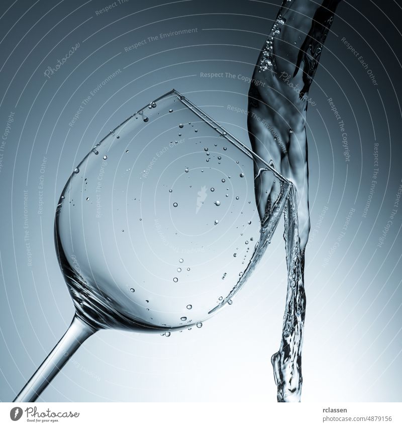 water collides with a wineglass alcohol alcoholic glasses bar spirits bordeaux celebration gourmet catering beverage restaurant vintage provence drinking