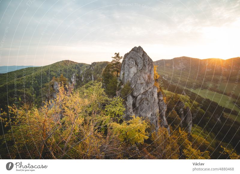 Sunrise at Sulov Rocks in eastern Slovakia. Rough, untouched landscape with rocks in orange light panoramic mountain scene wood adventure climber natural