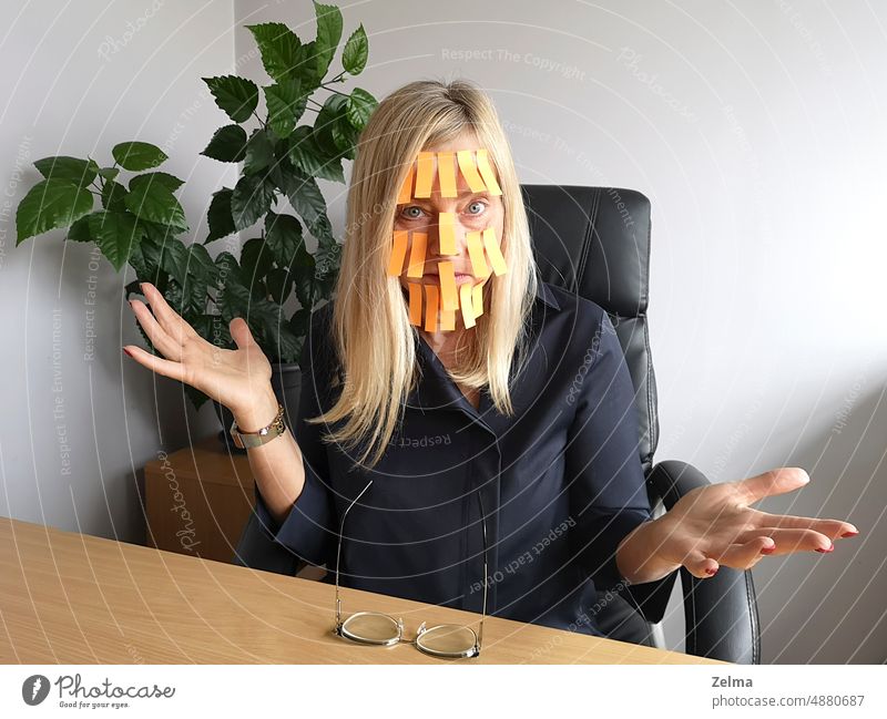 Tired and depressed mature business woman with many yellow memo note on her face, closeup portrait. sticky middle adult tired depression stress lots work office