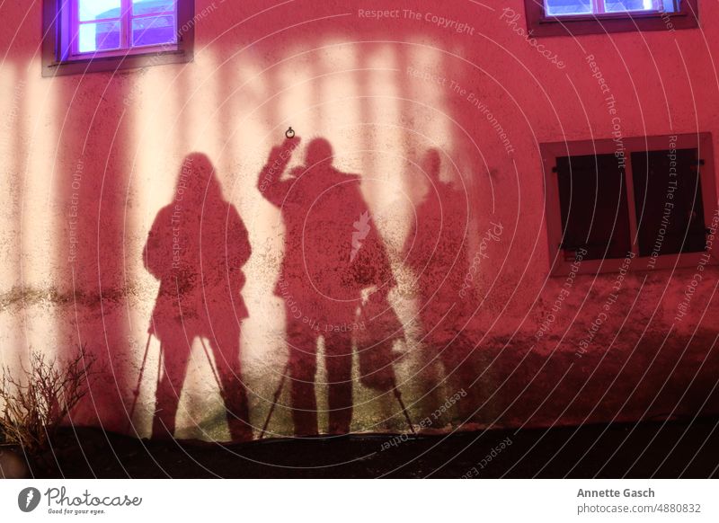 Three photographers play with the shadow Long exposure Shadow play Selfie people silhoutte silhouette