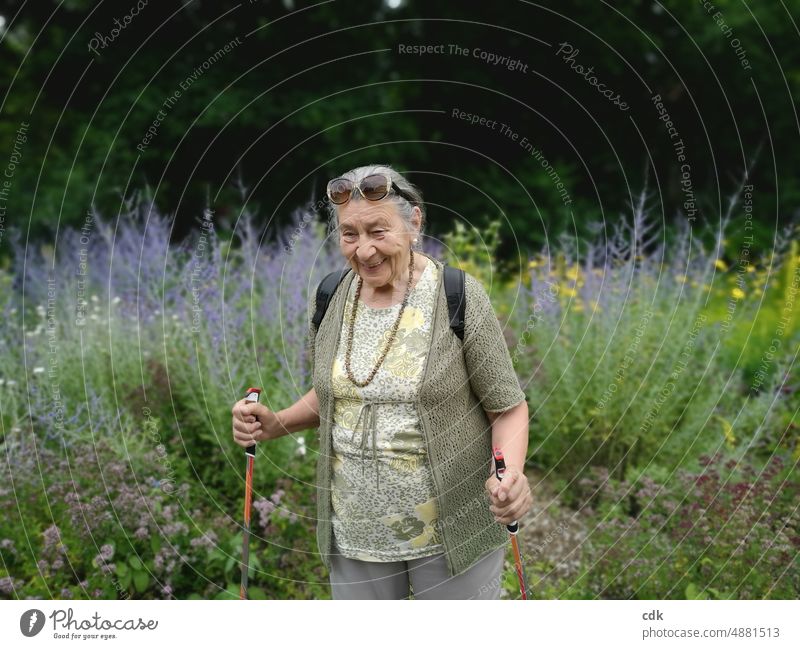 Summer walk | amused senior woman | walking among flowering herbs. Woman Lady Senior citizen Grandmother 80+ Human being portrait Retirement Healthy Contentment