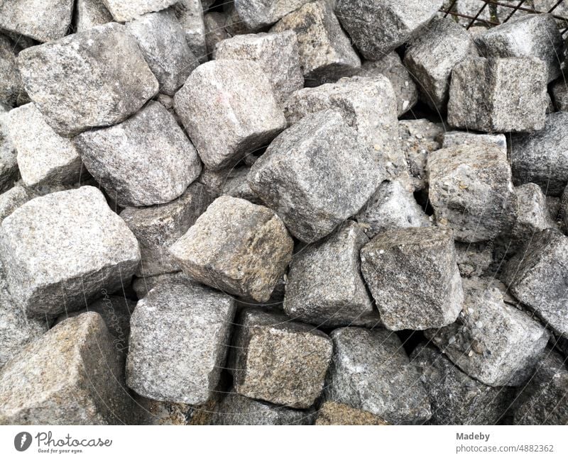 Gray cobblestones of the old cobblestone main street during construction work in the old town of Oerlinghausen near Bielefeld on the Hermannsweg in the Teutoburg Forest in East Westphalia-Lippe