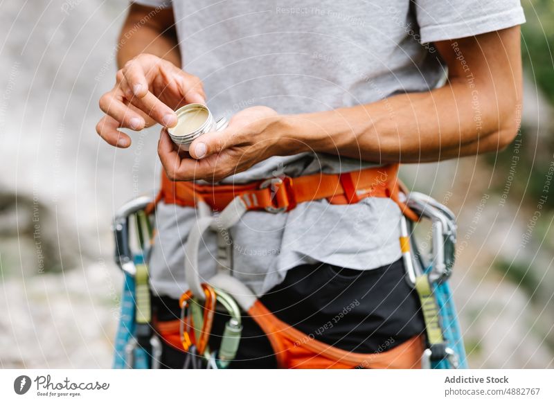 Male Hiker Holding Balm Standing With Harness Applying Midsection Climbing Hiking Adventure Hand Activity Preparing Travel Exploration Vacation Trekking