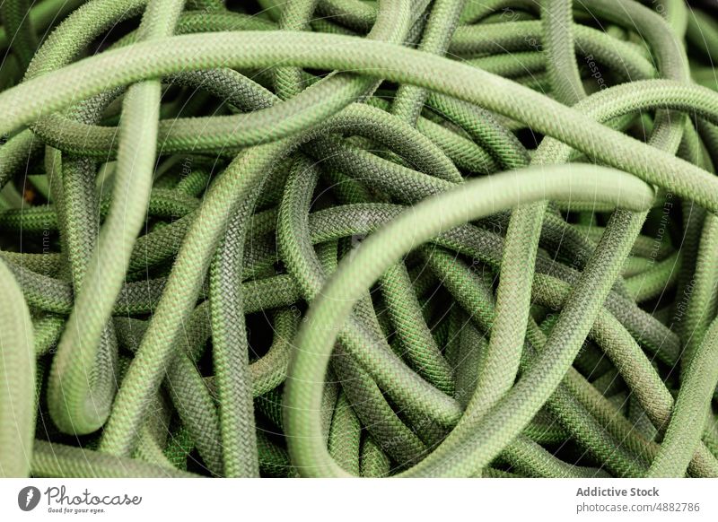 Stacks of green ropes in close-up Rope Hiking Sport Climber Green Equipment Climbing Hiker Adventure Activity Exploration Vacation Safety Trekking