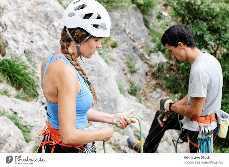 Couple Preparing For Rappelling Rope Hiker Climber Hiking Adventure Together Activity Standing Helmet Travel Safety Exploration Vacation Challenge Cliff