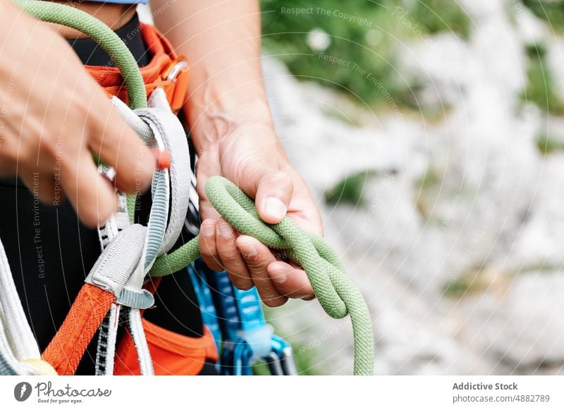 Midsection Of Woman Tying Rope On Harness Female Hiker Rappel Front View Prepare Closeup Climber Hiking Adventure Hand Activity Exploration Vacation Safety