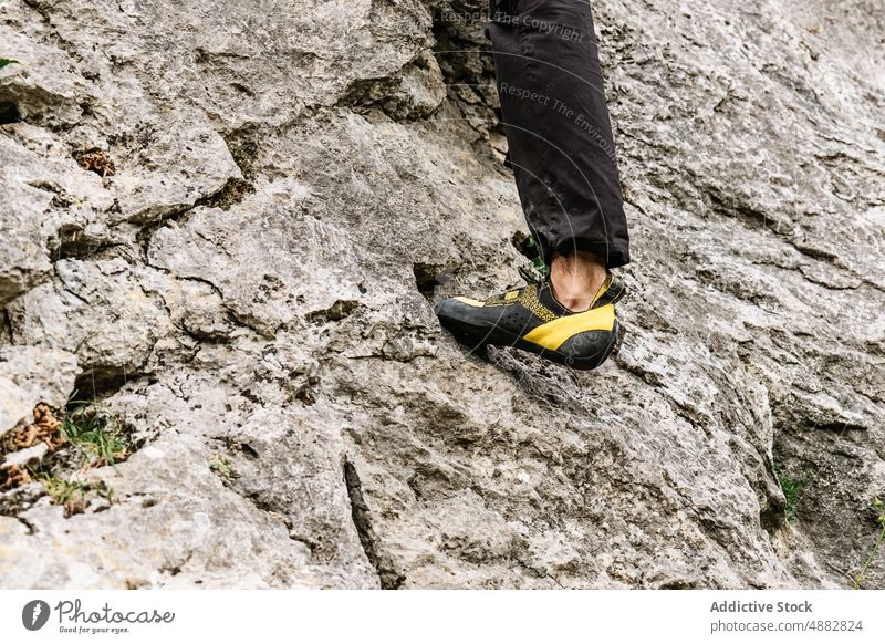 Low Section Of Male Hiker On Rocky Cliff Sport Shoe Climber Climbing Mountaineering Hiking Adventure Risk Activity Exploration Danger Vacation Trekking