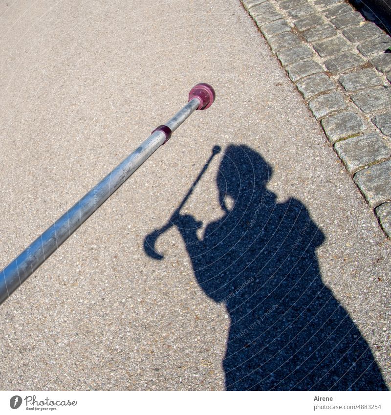 myself | giving direction Shadow Woman Crutches Street reha prop walking threatening gesture Therapy Patient shadow cast Neutral Background wounded Walking aid