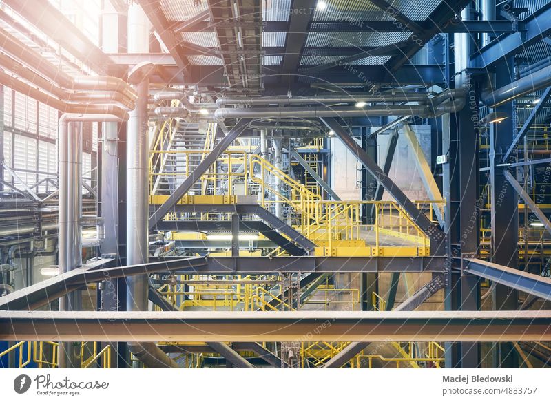 Industrial infrastructure in a waste incineration plant. factory industry interior industrial pipe nobody technology system production energy concept