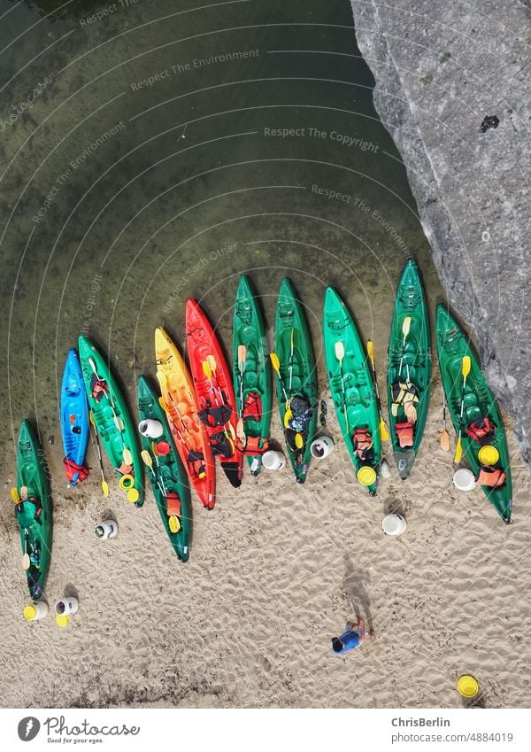 Bird's eye view of colorful canoes Canoe Water River Nature Summer Paddle Adventure activity Canoe trip vacation Relaxation Tourism voyage Sports Kayak bank