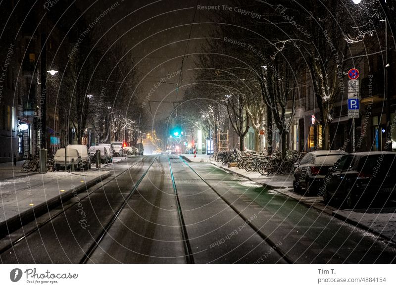 At night in winter in chestnut avenue Prenzlauer Berg Winter Night Snow Colour photo Railroad tracks Berlin Exterior shot Town Capital city Downtown Old town