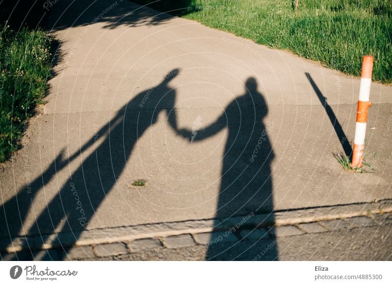 Shadow of couple holding hands Couple relation at the same time hold hands Relationship Together Lovers Infatuation In pairs two in twos Harmonious Affection