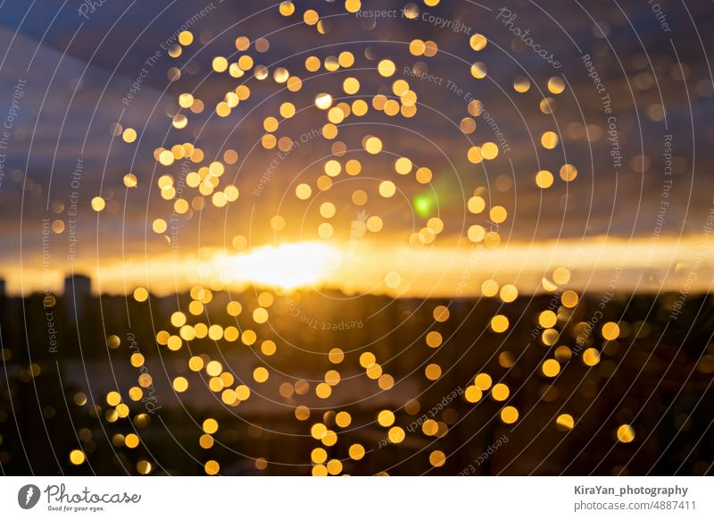 Blurred raindrops on glass window at sunset golden Rain Drop Window Glass hazy bokeh Wet Bulb Complete frame clearer Considerations background Christmas Pattern