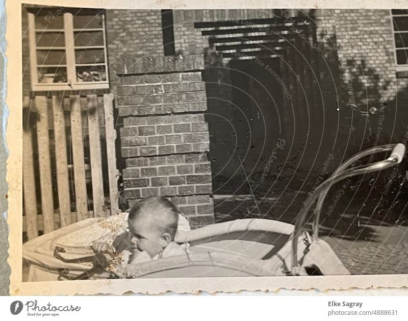Old ,analog photo 1949 child in baby carriage old Analogue photo old photo Black & white photo Past Child Exterior shot Memory Former preserve Infancy