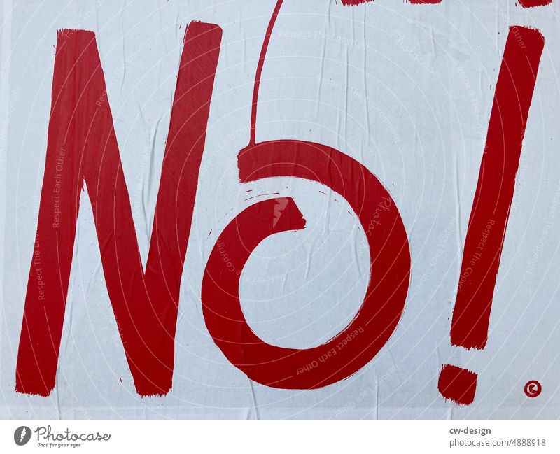 A red "No!" in closeup no Cancelation Exclamation Exclamation mark Characters Neutral Background Studio shot Copy Space bottom Copy Space top Copy Space left