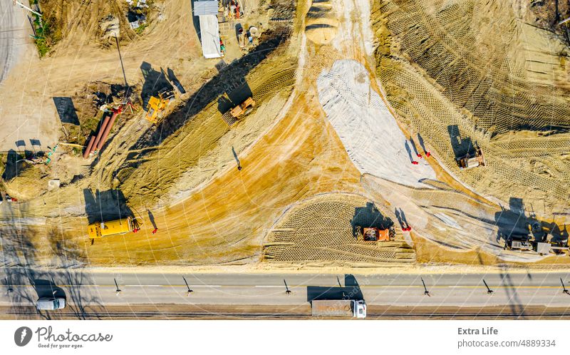 Aerial view on active traffic and road under construction, building the bridge with roundabout Above Architecture Area Asphalt Base Building Site Circle