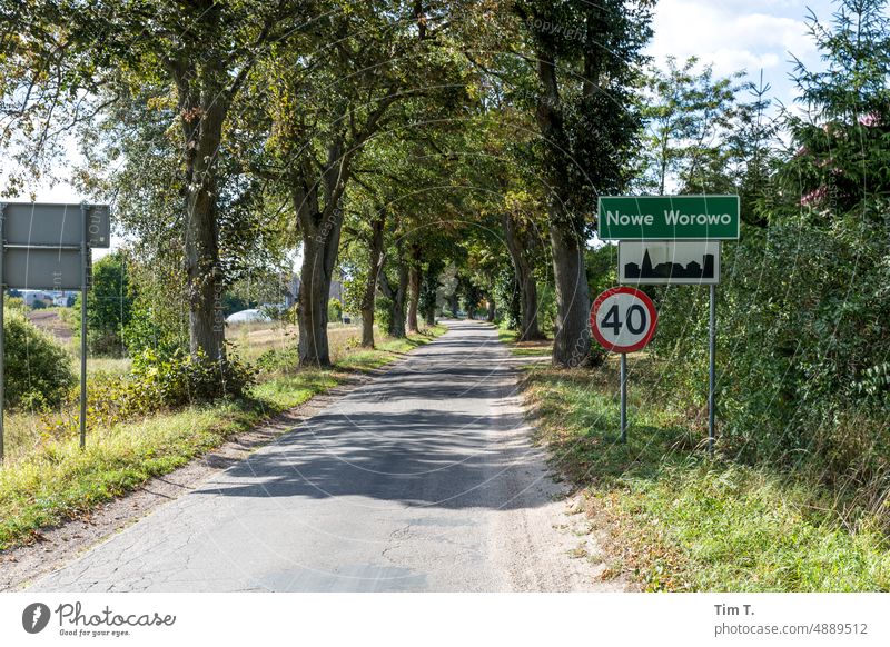 Entrance to the village with speed limit in Poland Avenue on one's own sign 40 Exterior shot Street Day Deserted Nature Colour photo Motoring Beautiful weather