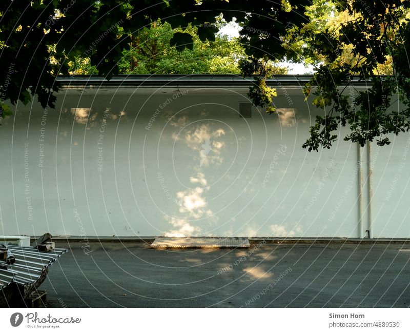 Light dots on white wall Backyard Wall (building) light points Shadow Facade Hiding place Lightshaft Courtyard Wall (barrier) open space Copy Space