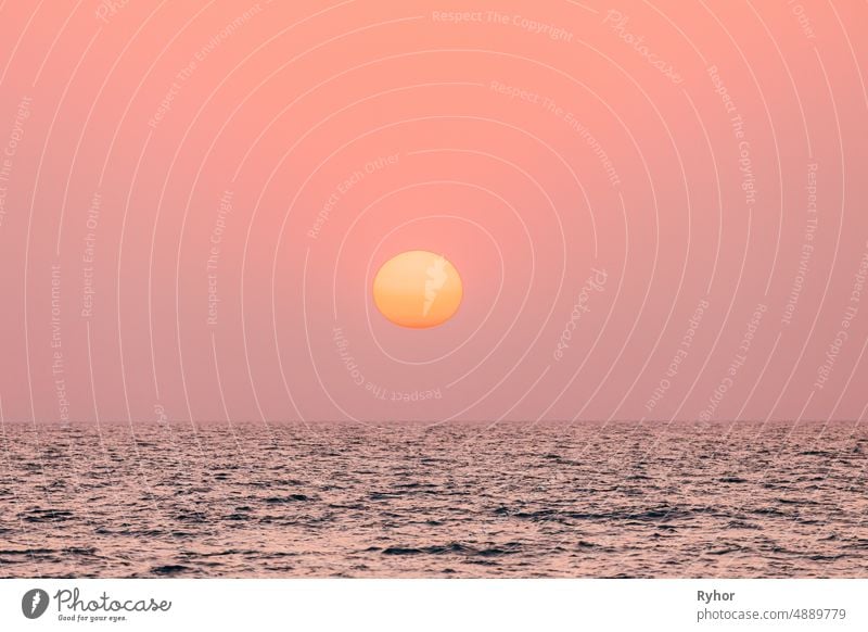 Natural Color Sunset Sunrise Sky Over Sea. Seascape With Shining Setting Sun On Sea Horizon beautiful big bright calm clear color copy space gently horizon hot