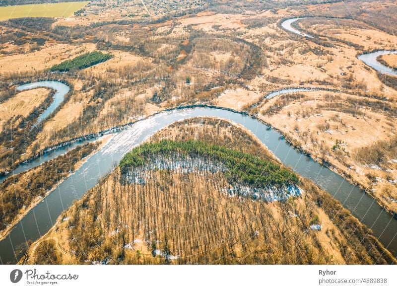 Belarus. Aerial View Of Dry Grass And Curved River Landscape In Early Spring Day. High Attitude View. Marsh Bog. Drone View. Bird's Eye View aerial aerial view