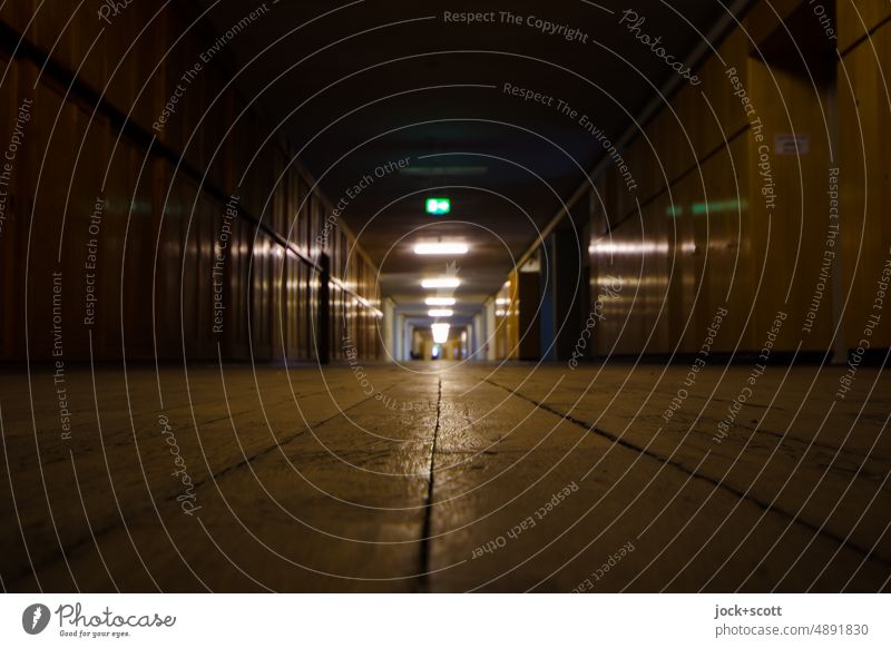 long and wide corridor Corridor Architecture Vanishing point Perspective Lanes & trails Hallway Room Horizontal Building Ground Tunnel vision Shadow Symmetry