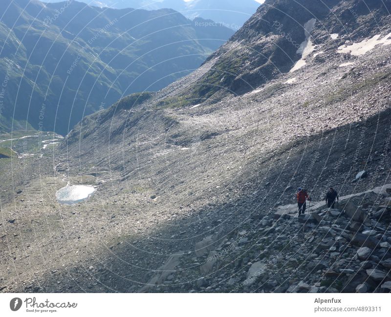 Light and shadow Mountaineering strenuous Peak Human being Exterior shot Climbing Hiking Alps mountain lake Effort Alpine tour Colour photo Rock Panorama (View)
