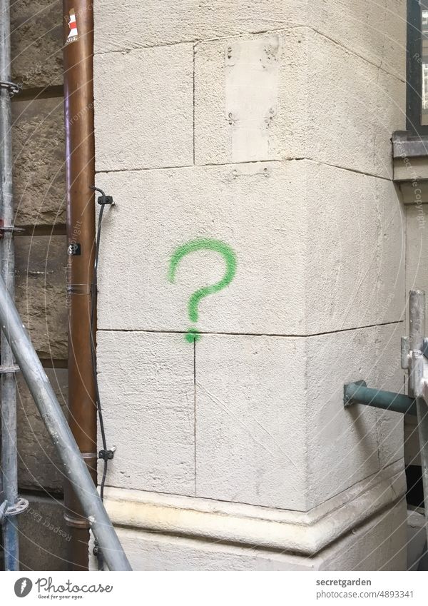 Perplexed at the construction site Construction site Question mark Wall (building) Graffiti Green White Wall (barrier) Sandstone unsuspecting Ask Characters